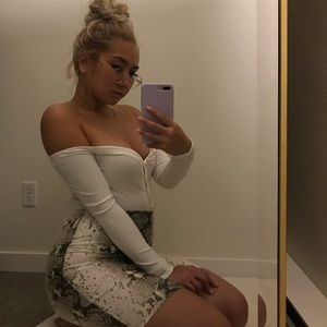 White body suit and snake skin skirt